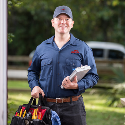 Santa Energy technician smiling and holding tool bag