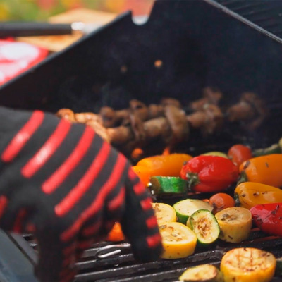 cooking kebabs on a grill