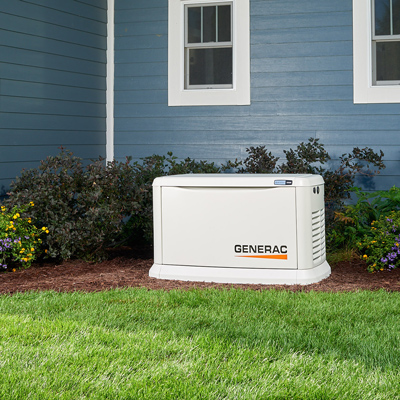 Generac generator in front of blue house